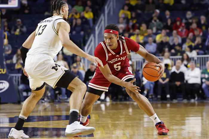 Indiana Hoosiers forward Malik Reneau (5) dribbles against Michigan Wolverines forward Olivier Nkamhoua (13) in the second half at Crisler Center.